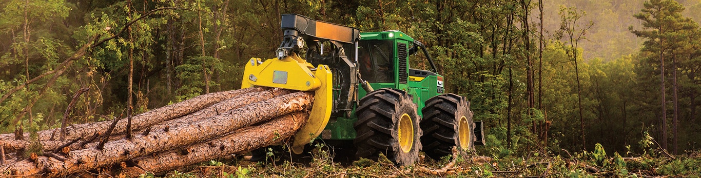 Grapple skidder hauling a load of logs