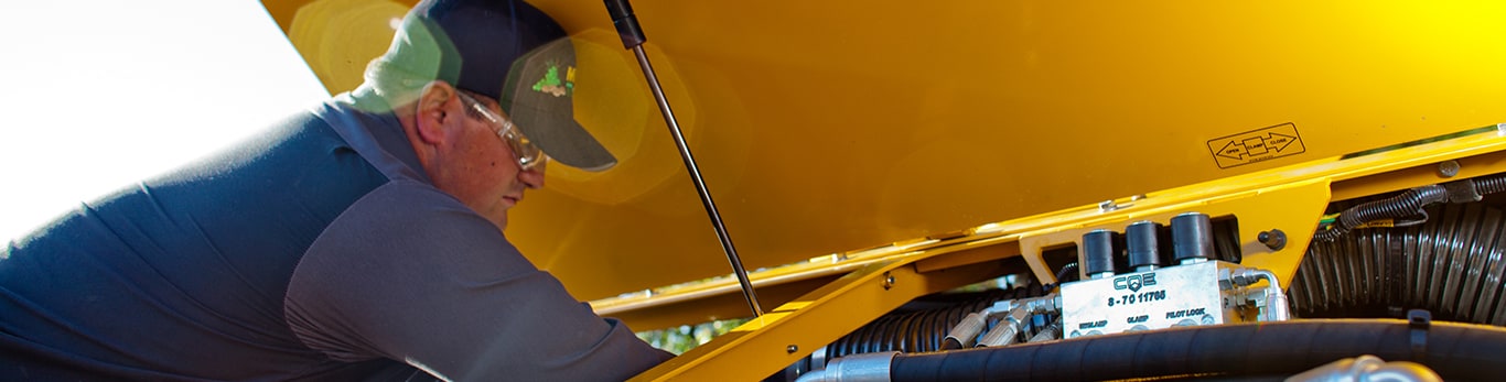 Man Working on John Deere Engine