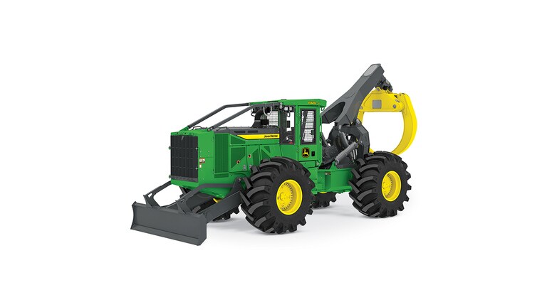 Green and yellow forestry machine with large tires and front grapple attachment.