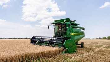 C-Series Combine Photo of Combine moving through crops