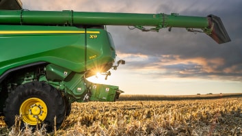 X Series Combine Moving through crops