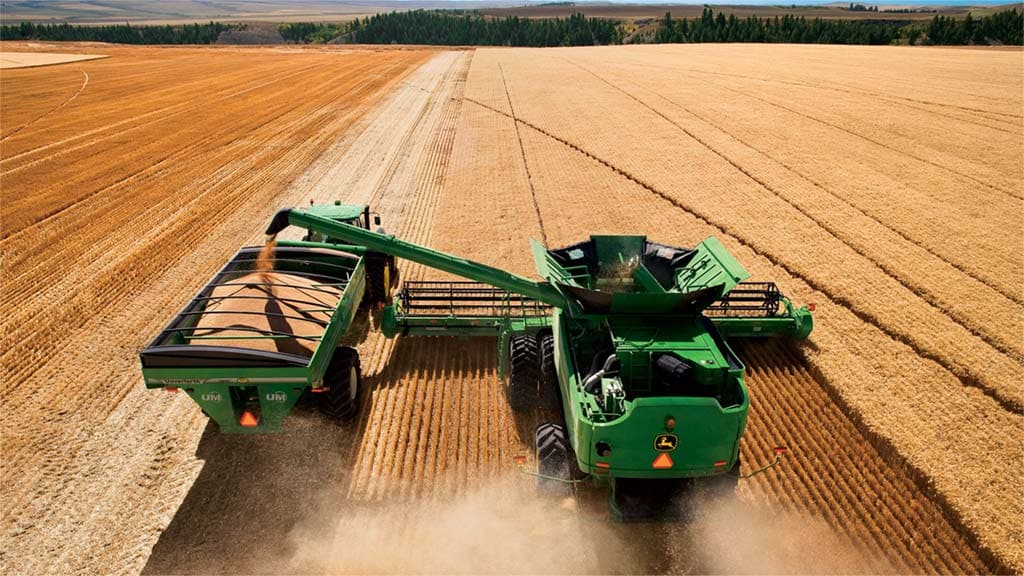 perfect balance found photo of combine in field