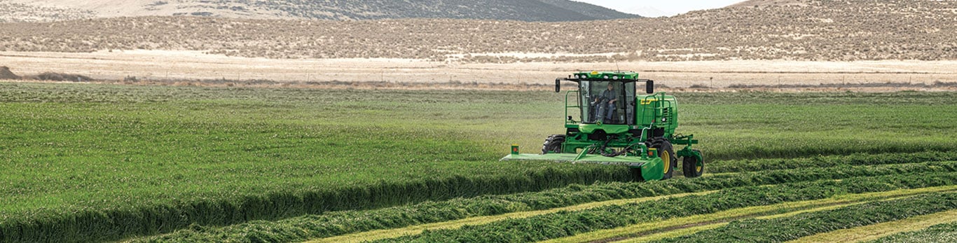 Windrower in field