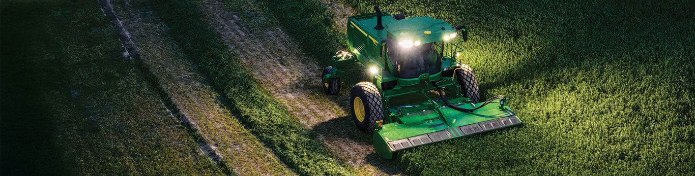 Nighttime image of a windrower and it's LED lighting