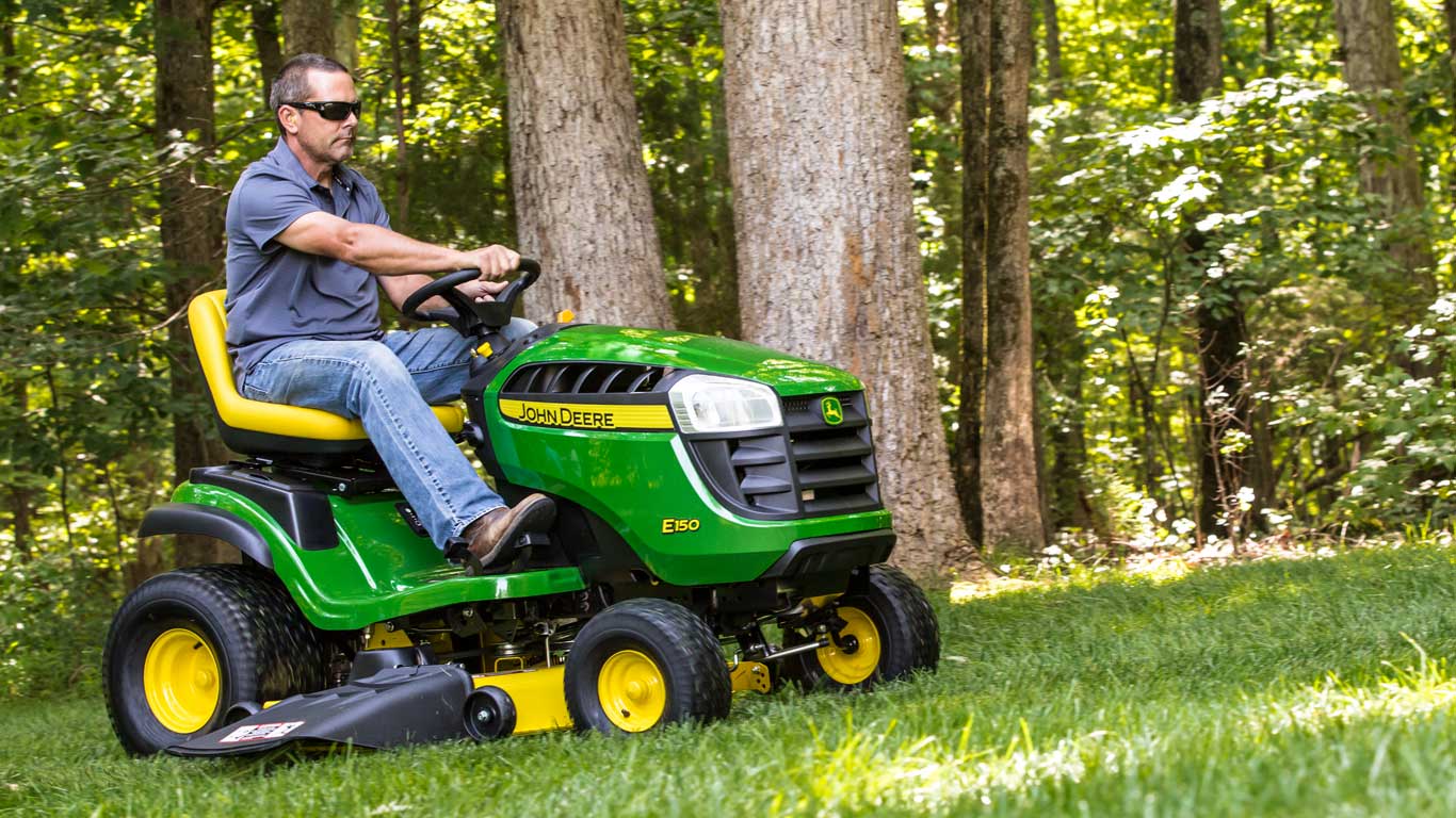 e100 Series tractor in residential front lawn