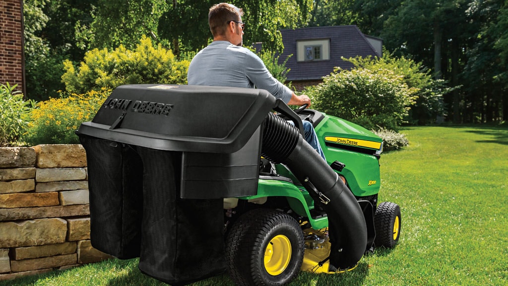 aerial view of x300 mower going through yard of leaves