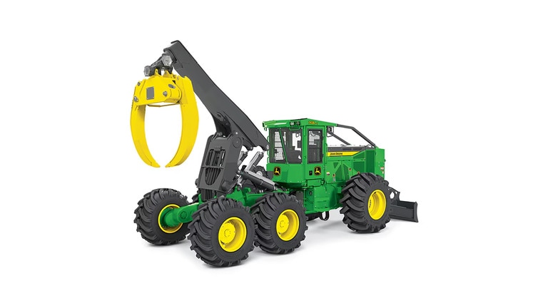 Green and yellow forestry machine with large tires and grapple arm for handling logs.